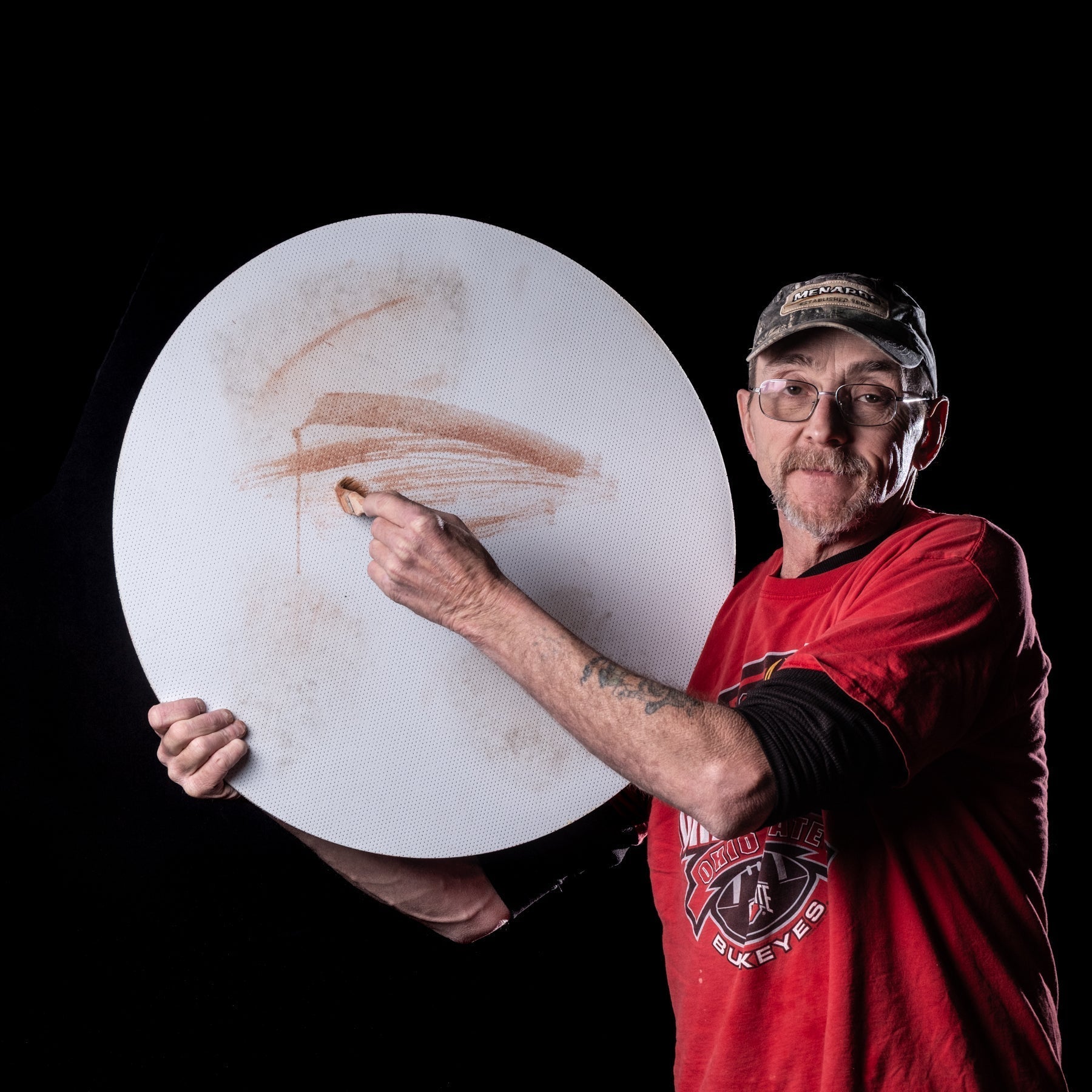 Roger with grinding wheel on a black background