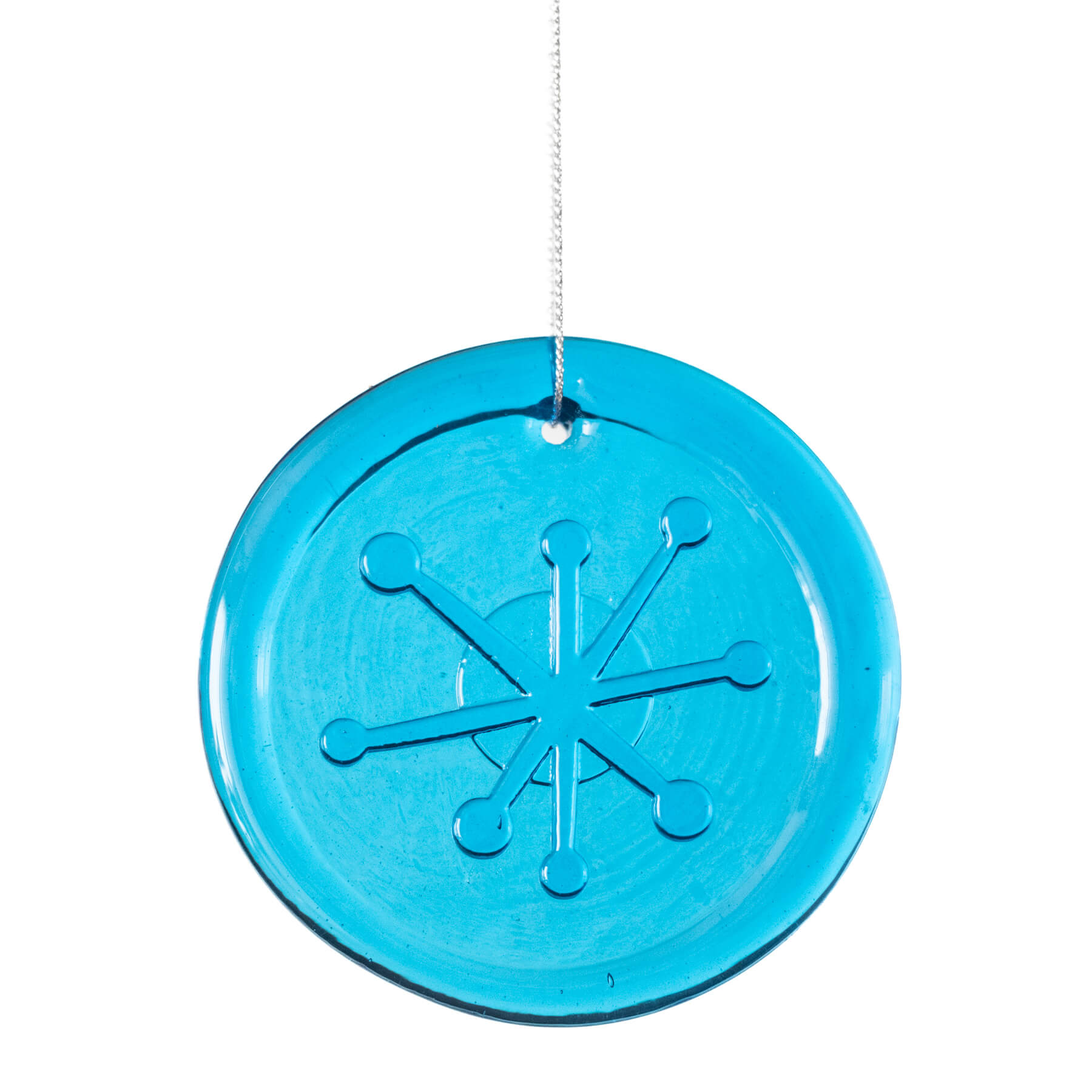 Blue circular ornament with a star-like design on a white background