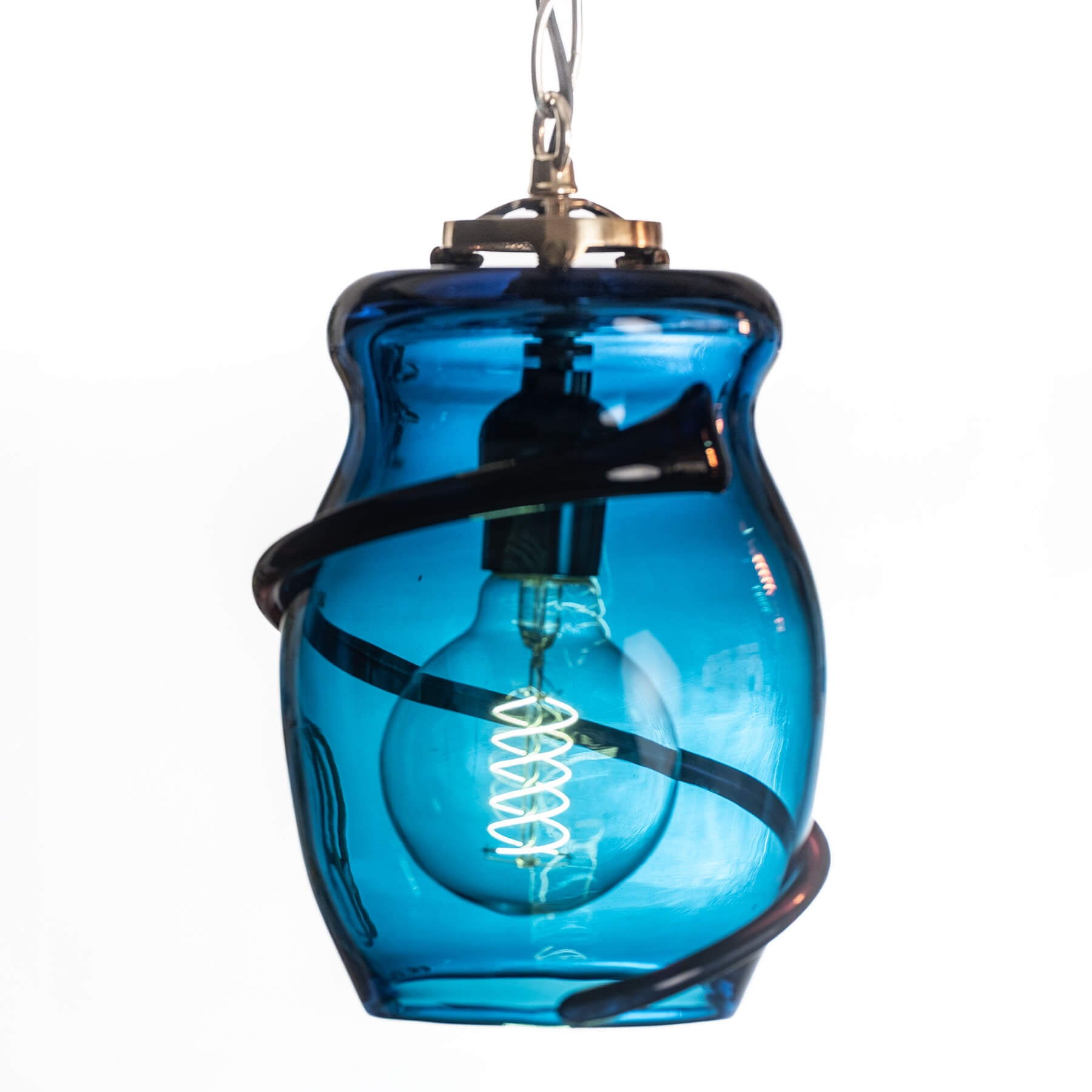 Blue glass pendant light with a visible bulb on a white background