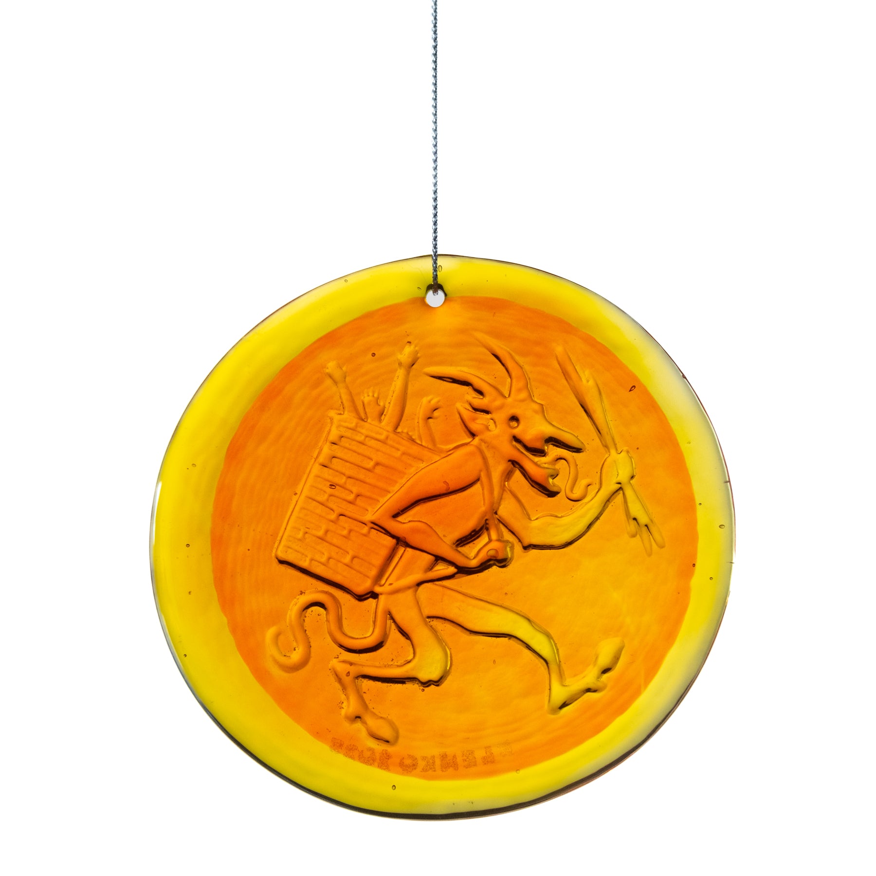 Decorative round ornament with a design of a person playing music on a white background