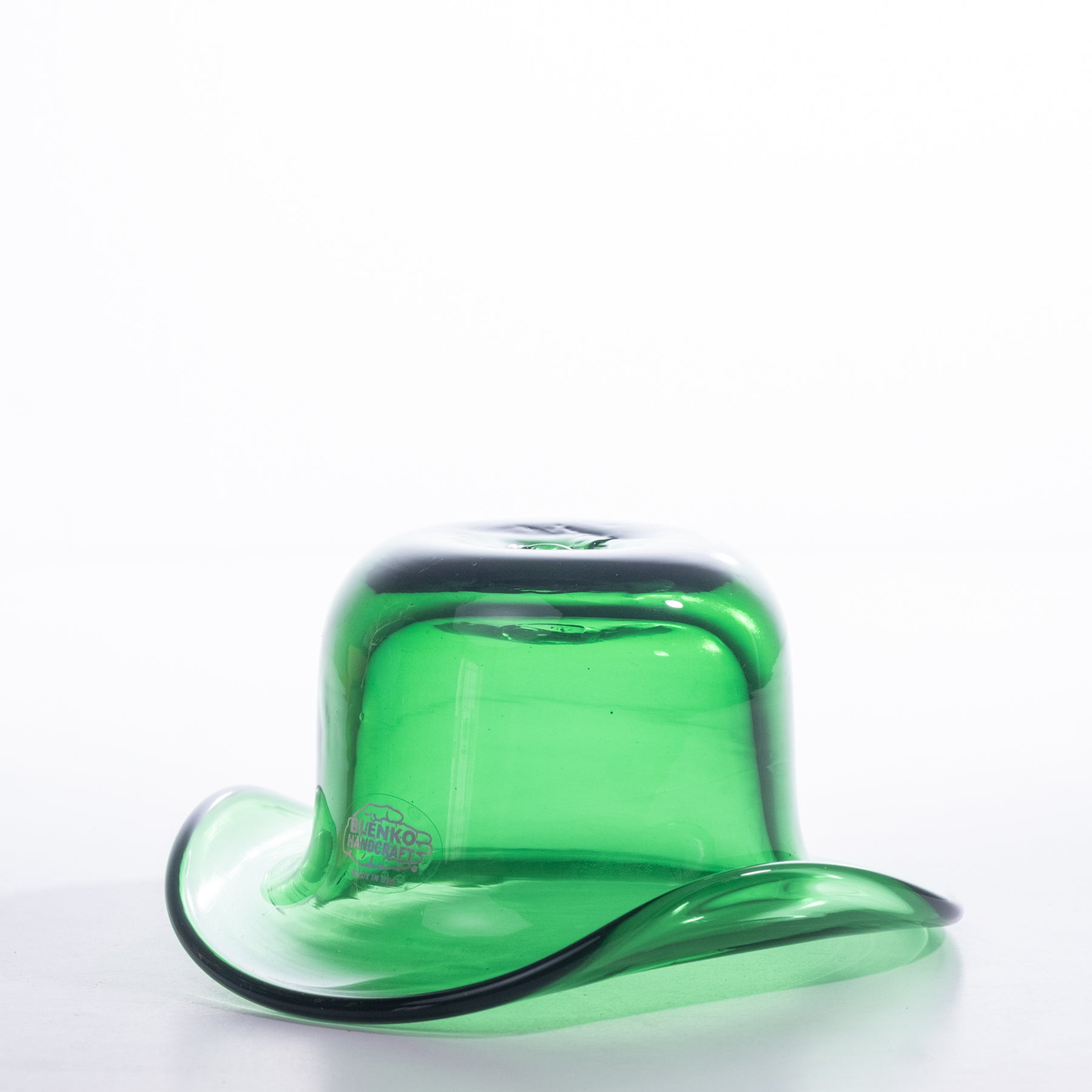 Green glass cowboy hat on a white background