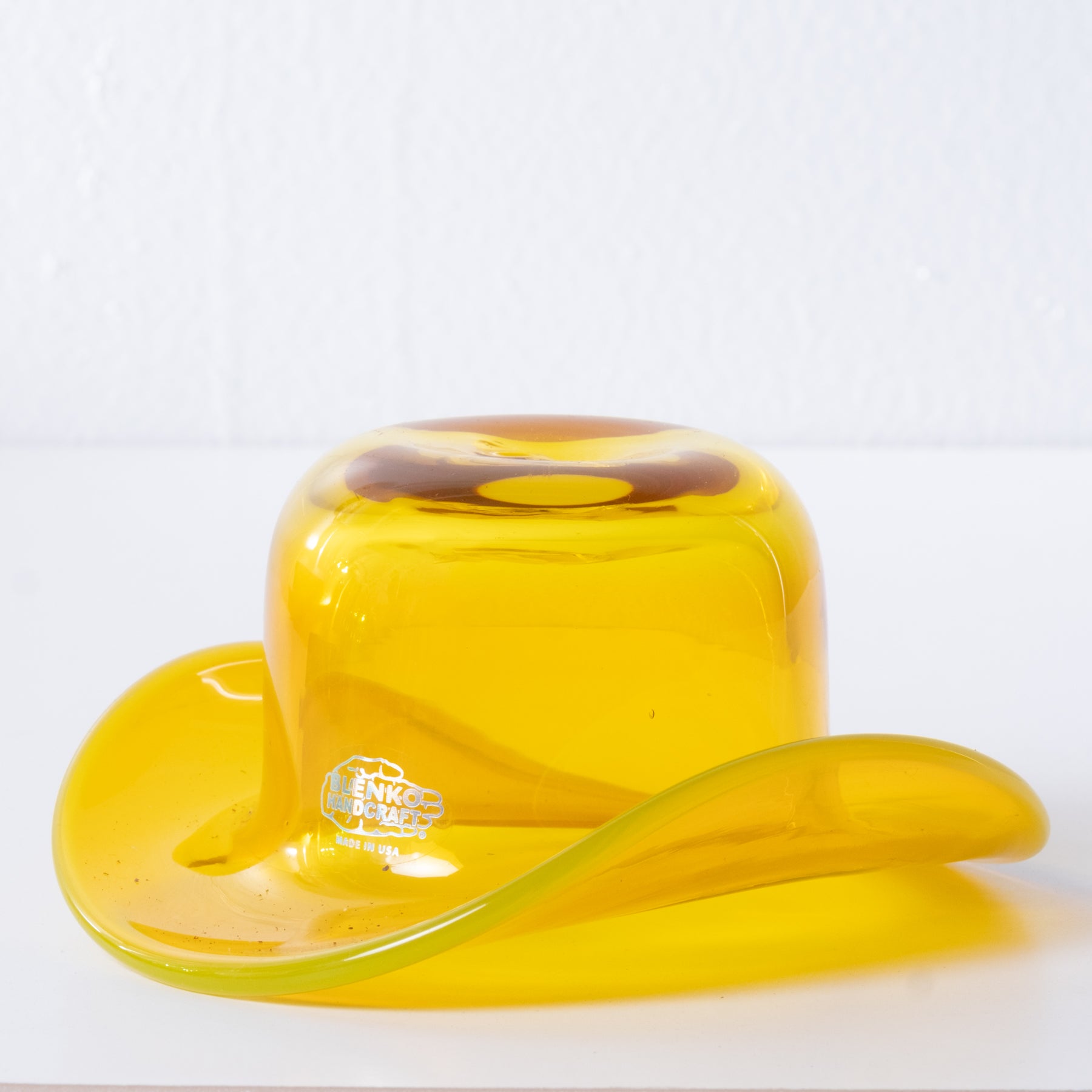 Yellow product with a logo on a white background