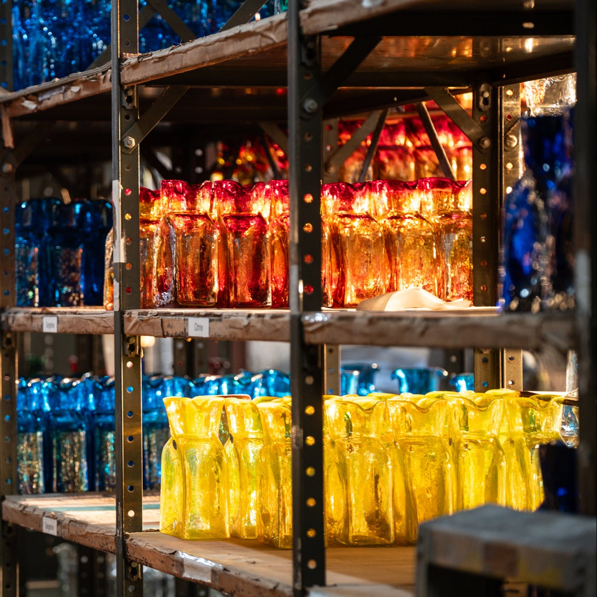 Shelves filled with colorful bottles in a warehouse setting