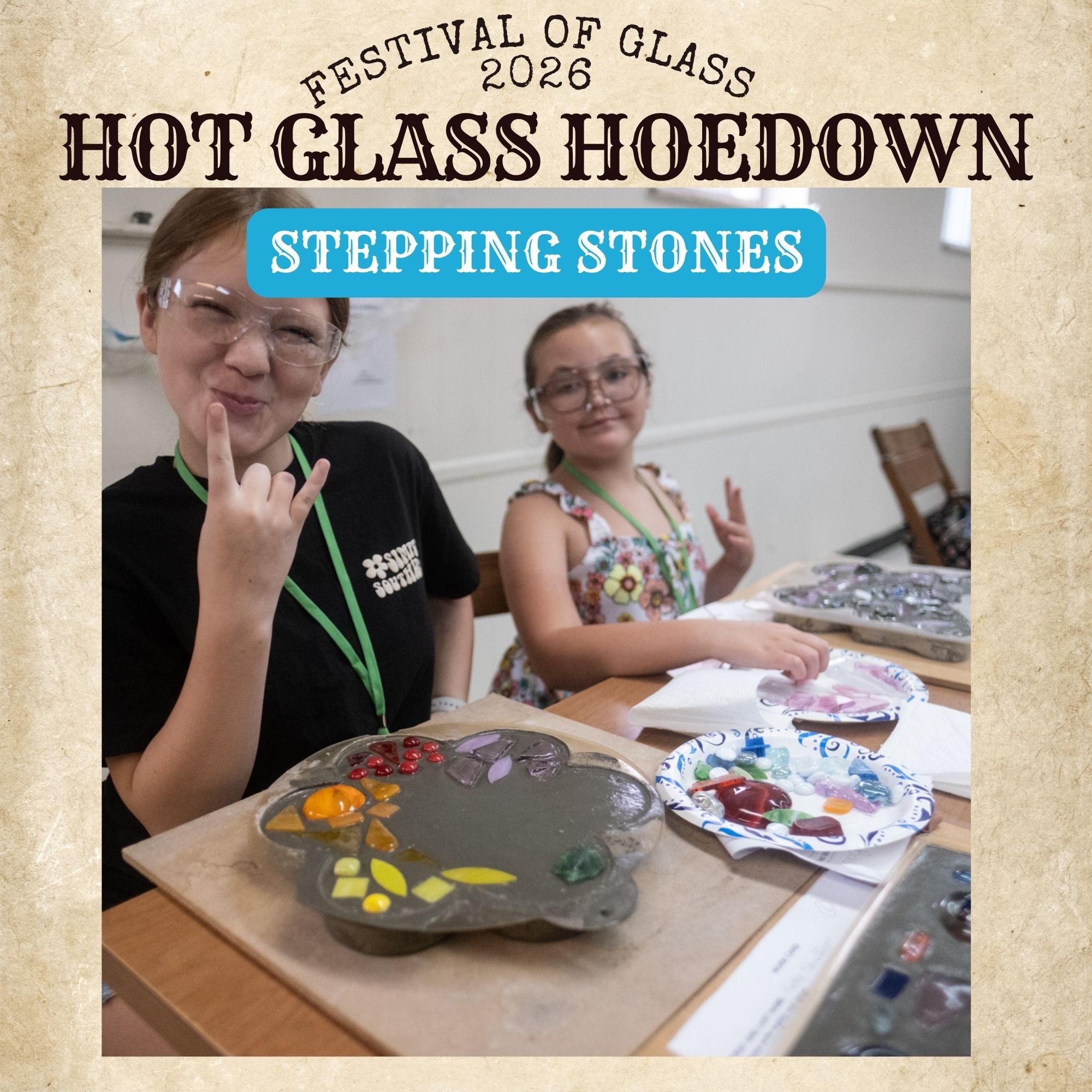 Two people at a table with art supplies, participating in a glass art activity, with text about the 'Festival of Glass 2026 Hot Glass Hoedown Stepping Stones'.