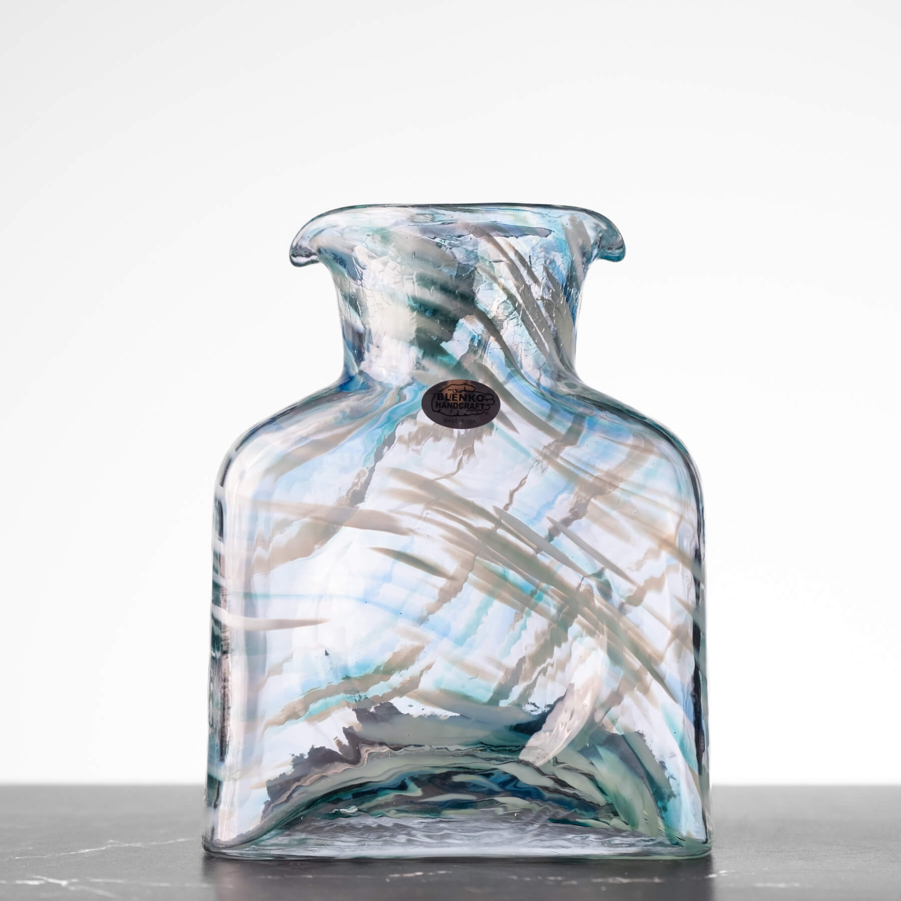 Glass vase with abstract design on a white background
