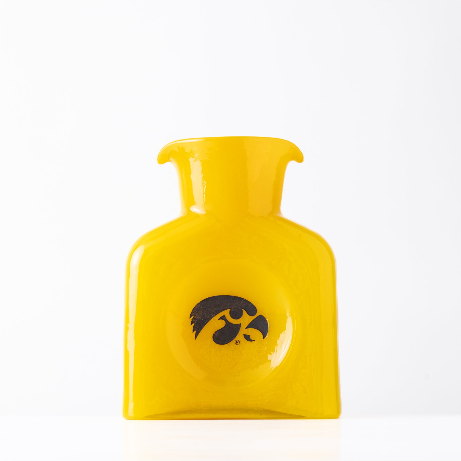 Yellow glass item with a logo on a white background