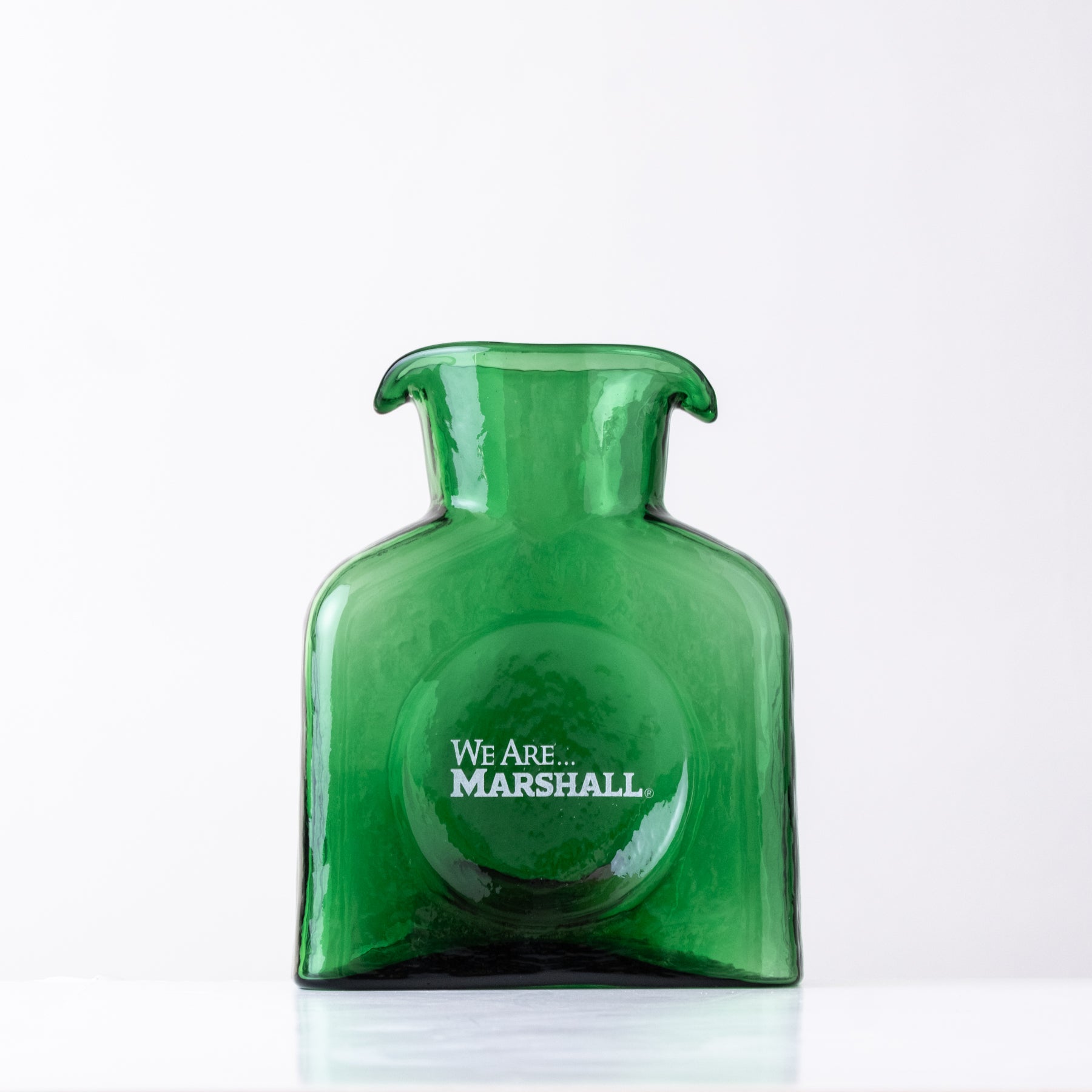 Green bottle with 'We Are Marshall' text on a white background