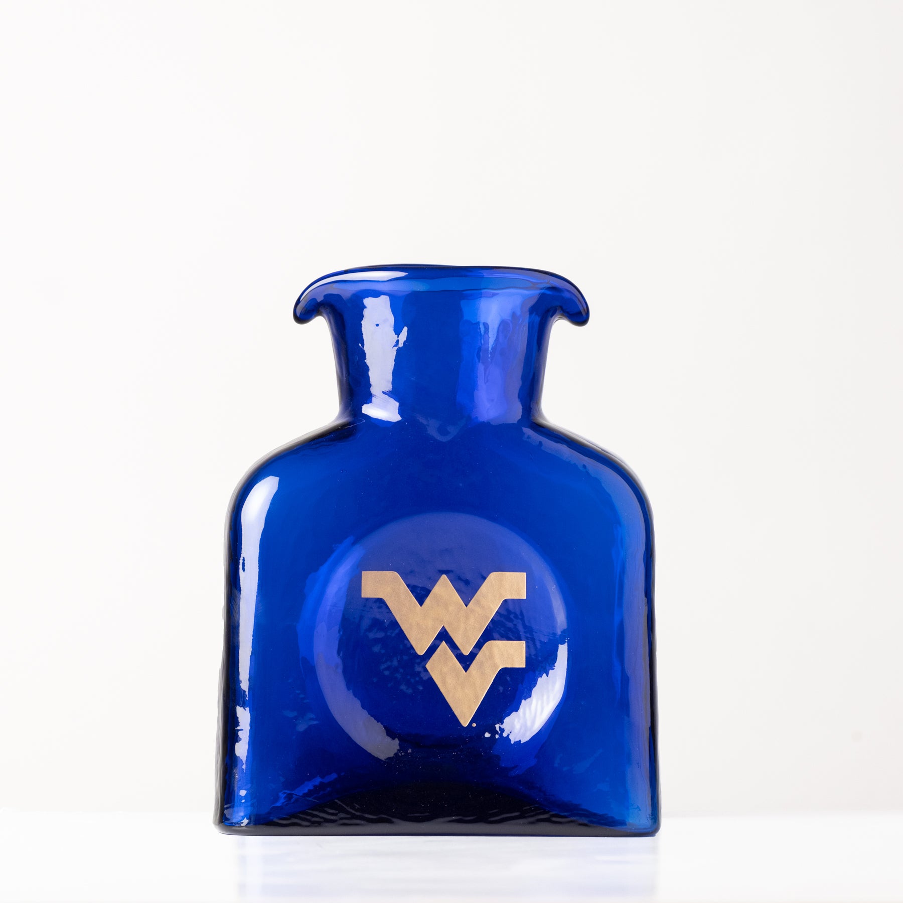 Blue glass bottle with a gold logo on a white background
