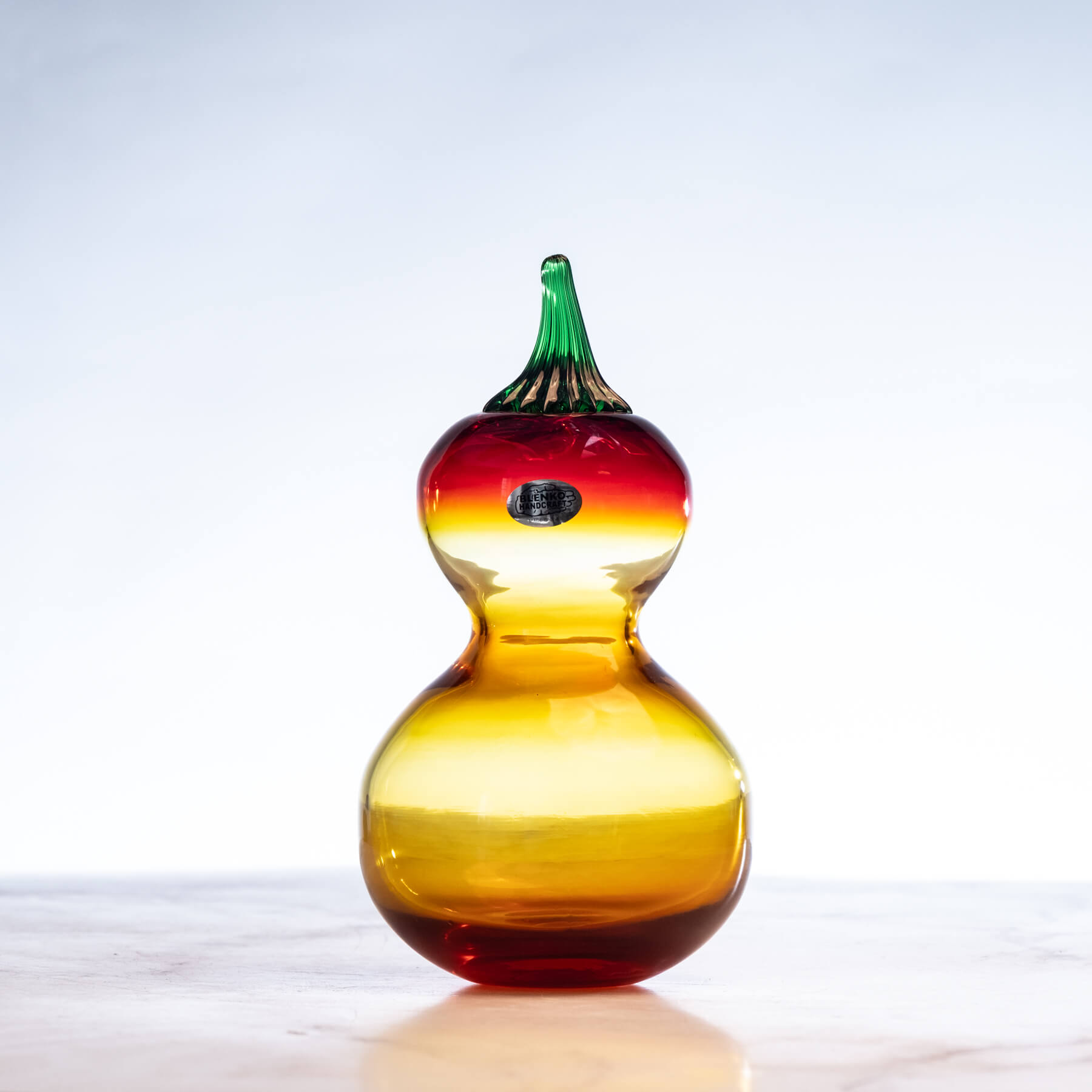 Colorful glass calabash gourd on a white background