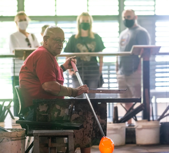 Onlookers watching glass being made
