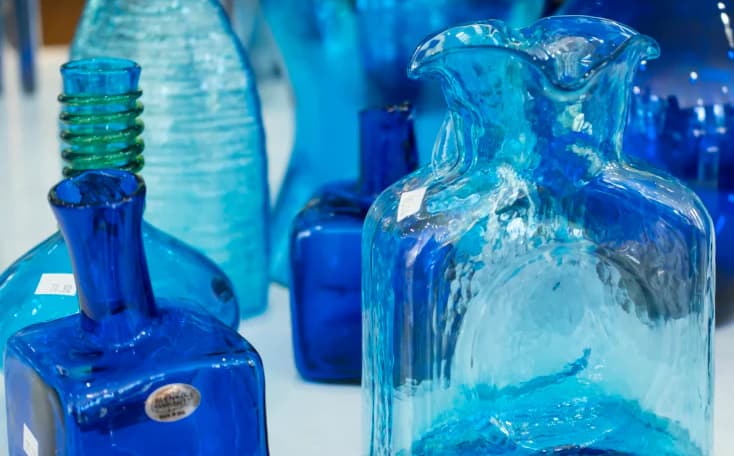 Blue items on a table in the gift shop