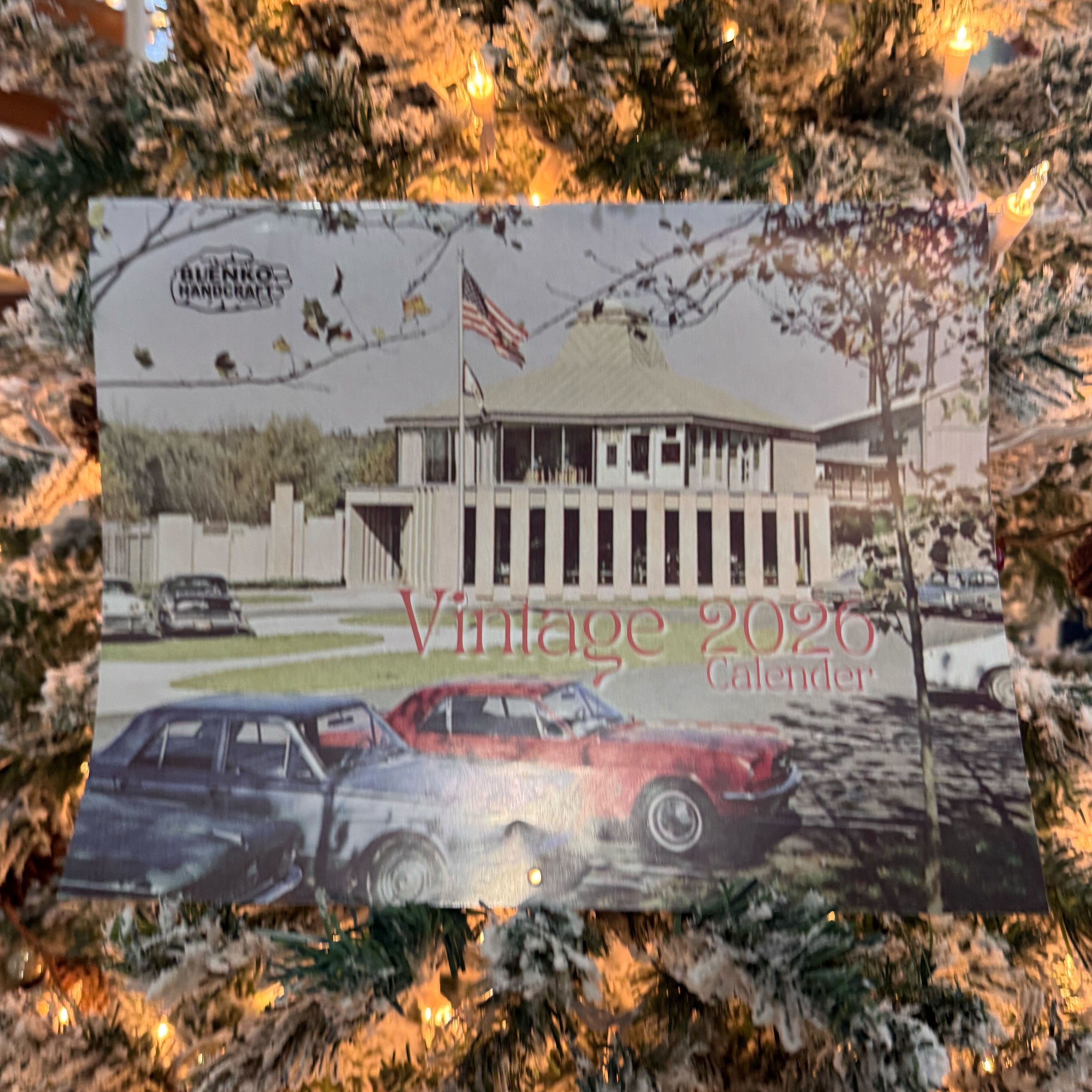 Calendar card for 2026 with vintage cars on a Christmas tree.