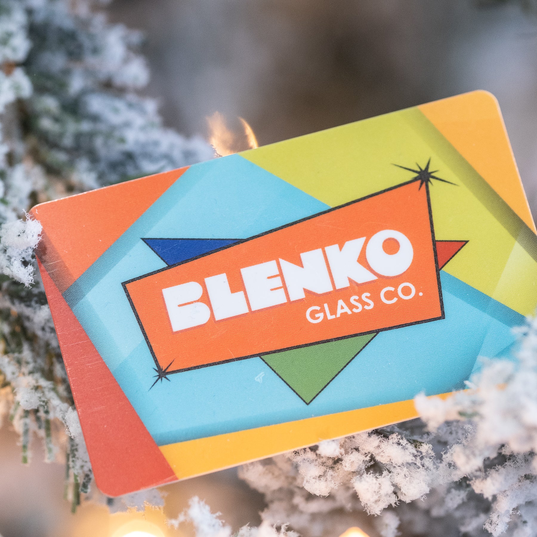 An e-gift certificate from Blenko Glass Co. displayed on a Christmas tree.