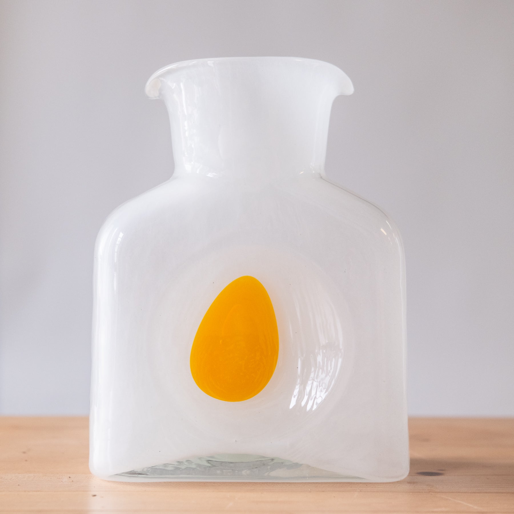 White water bottle with yellow "egg yoke" center