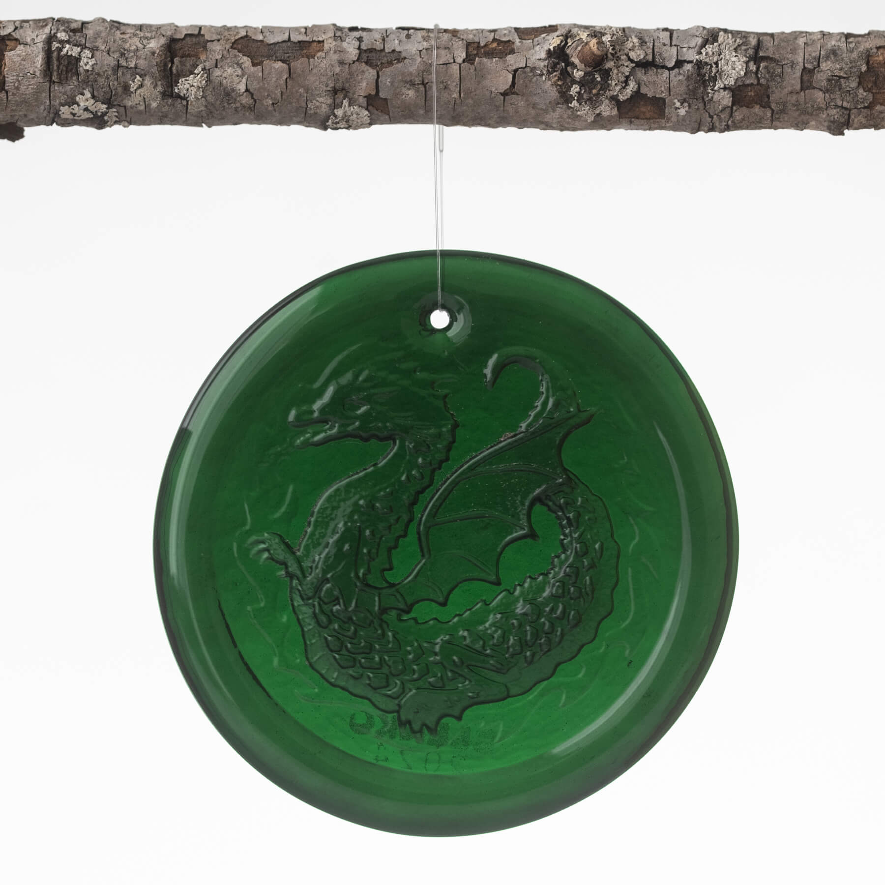 green sun-catcher with a dragon on it