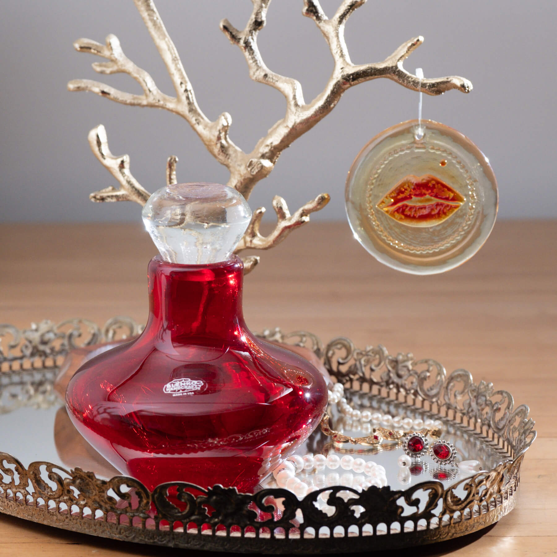 Red decanter with tangerine suncatcher
