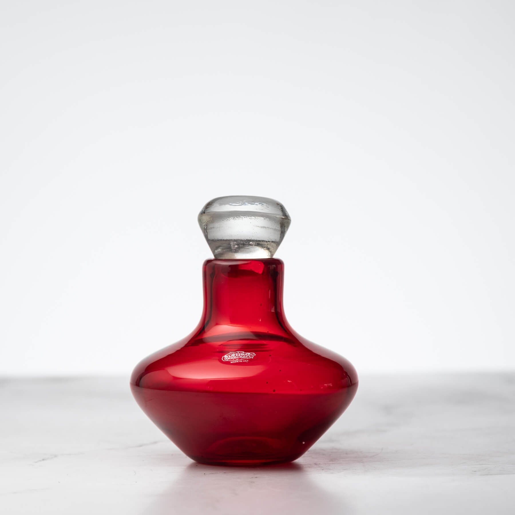 Red decanter on  white background