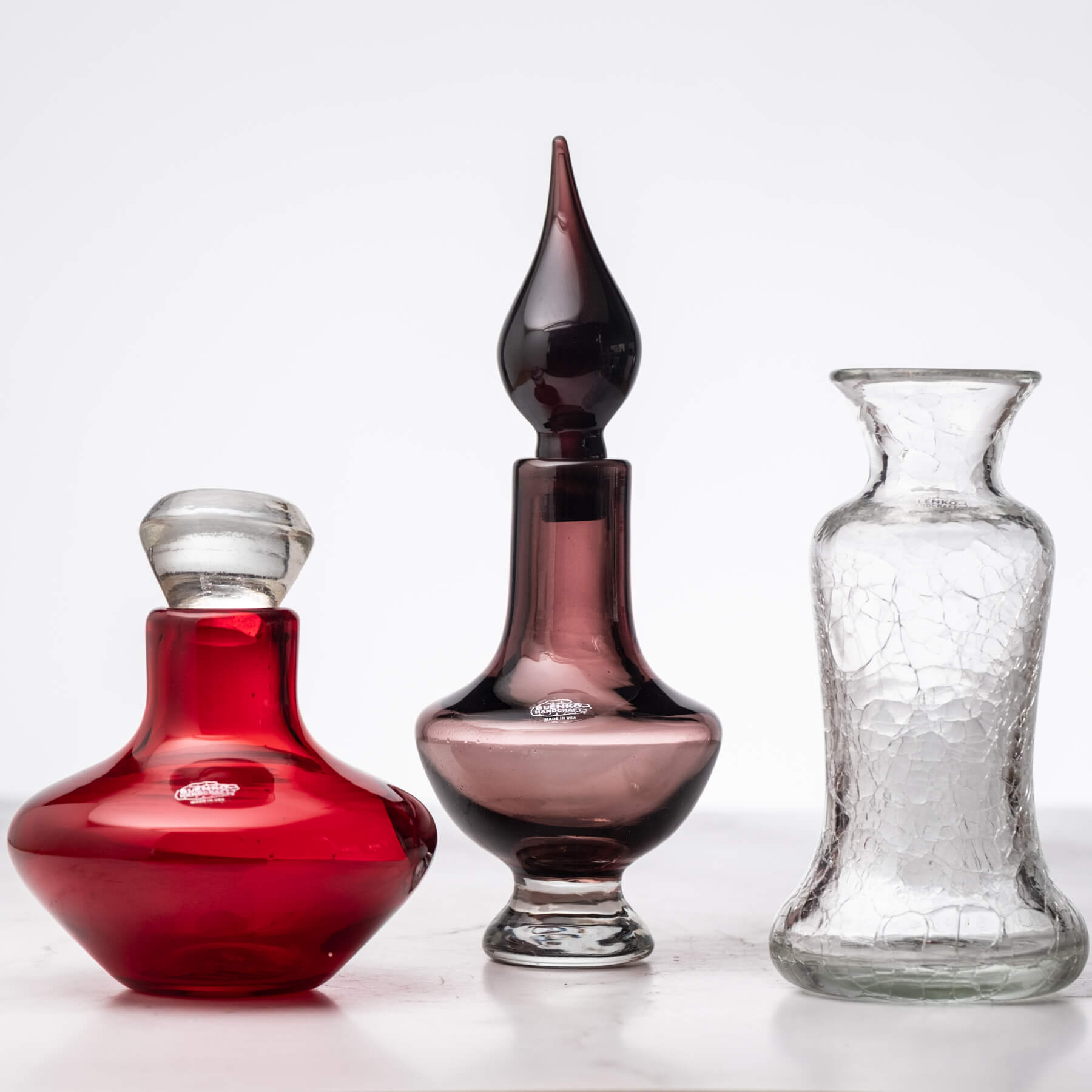 Three glass items on white background
