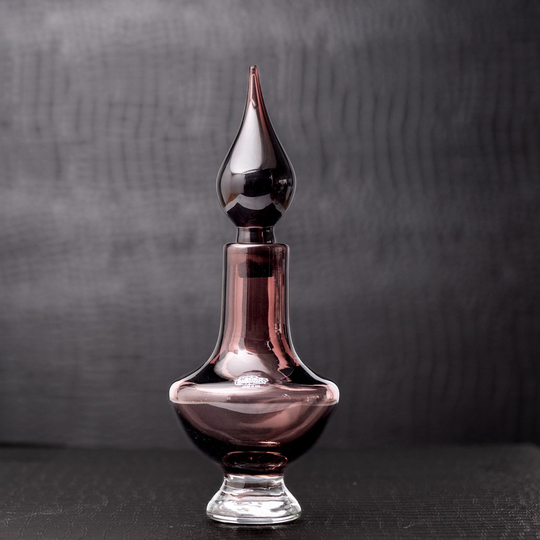 Amethyst decanter on grey background