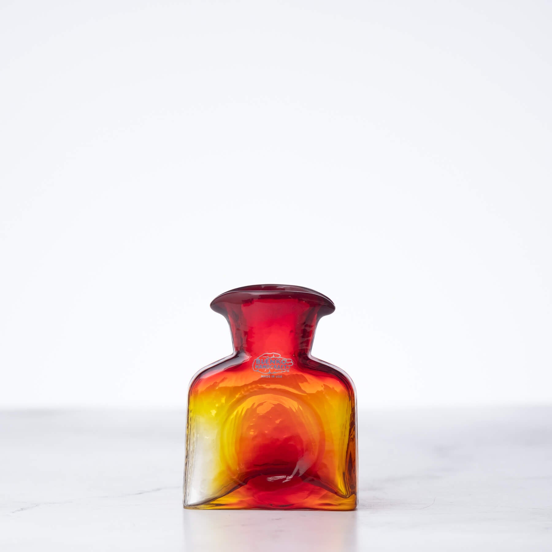 Multicolored glass bottle on a white background