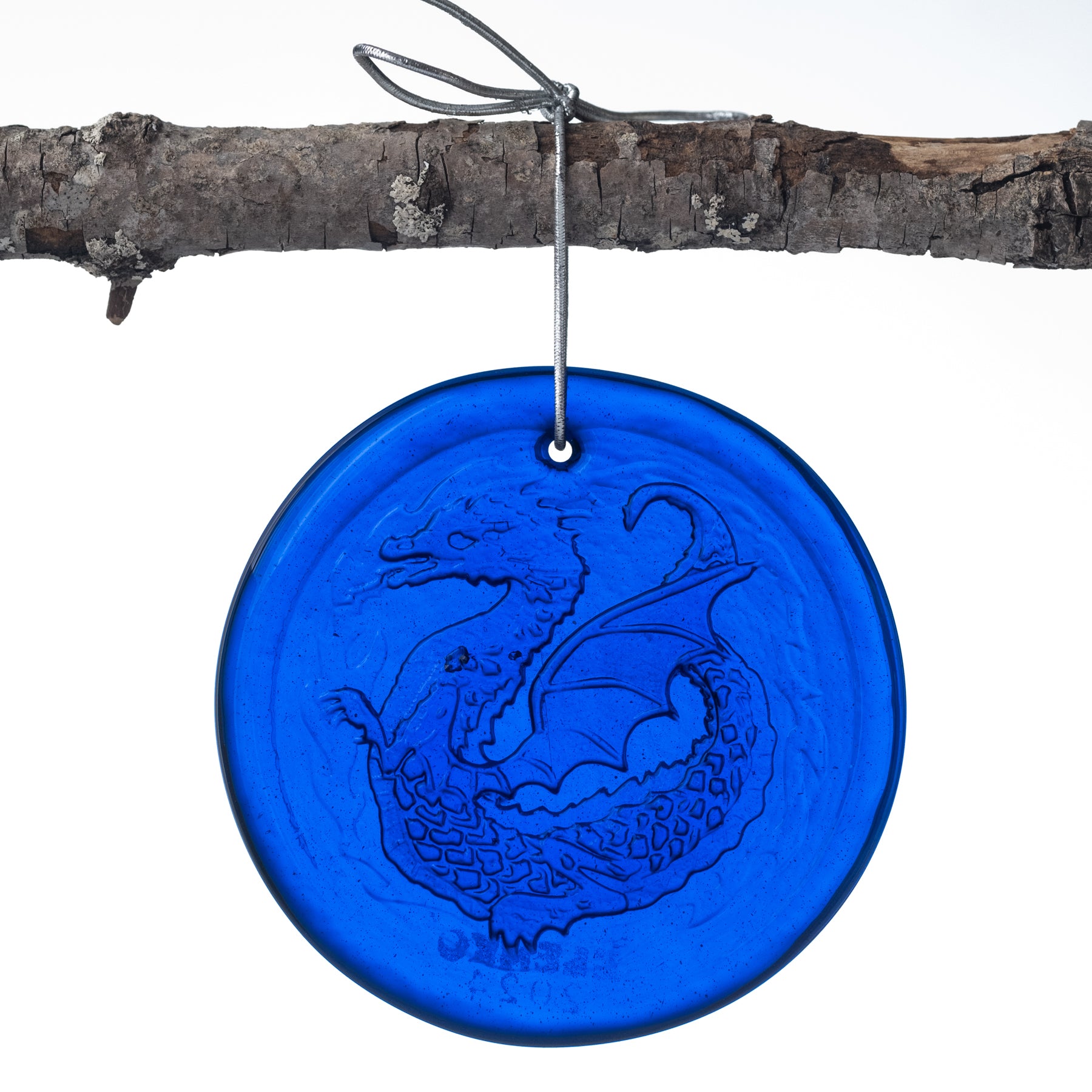 blue sun-catcher with a dragon on it