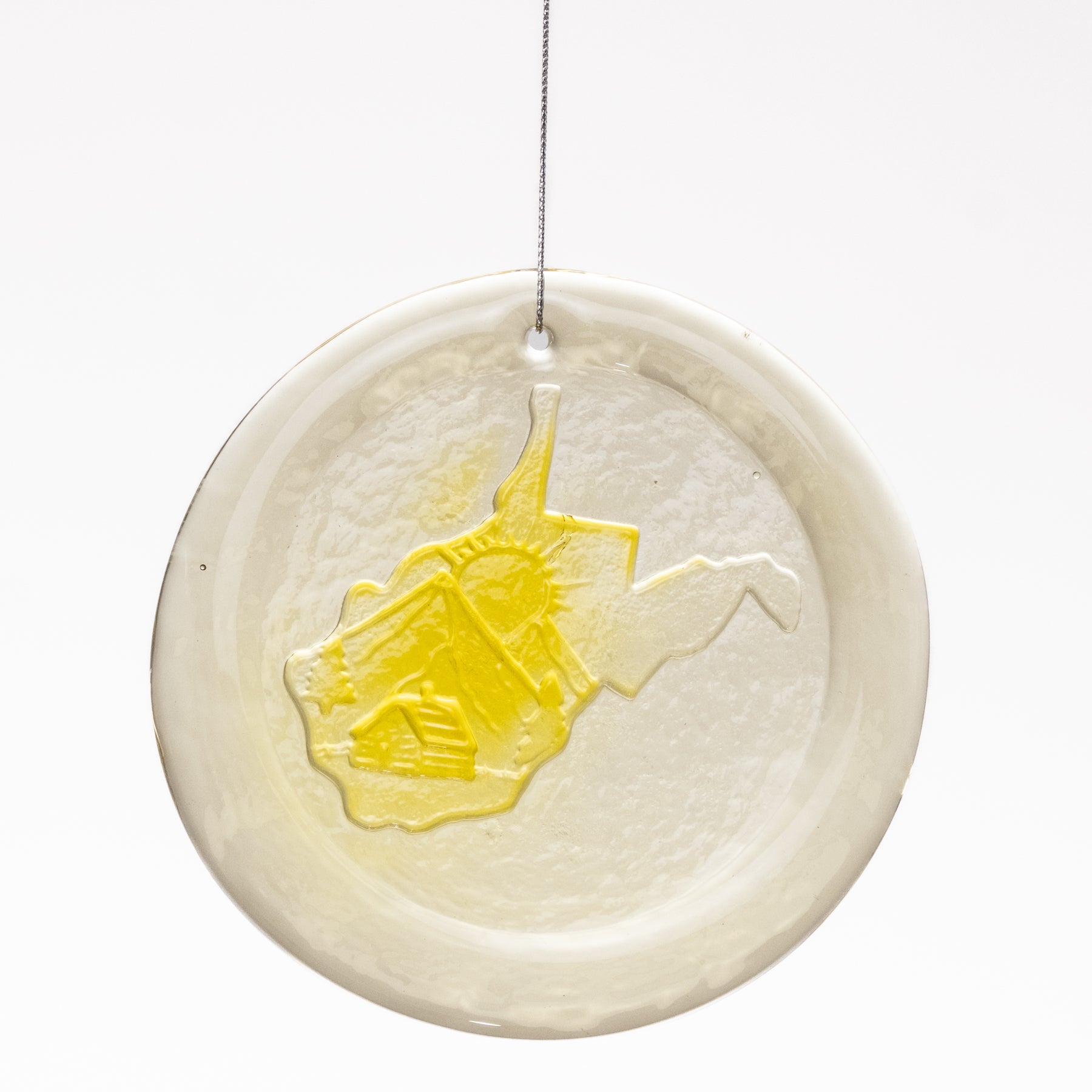 Decorative plate with a yellow elephant design on a white background