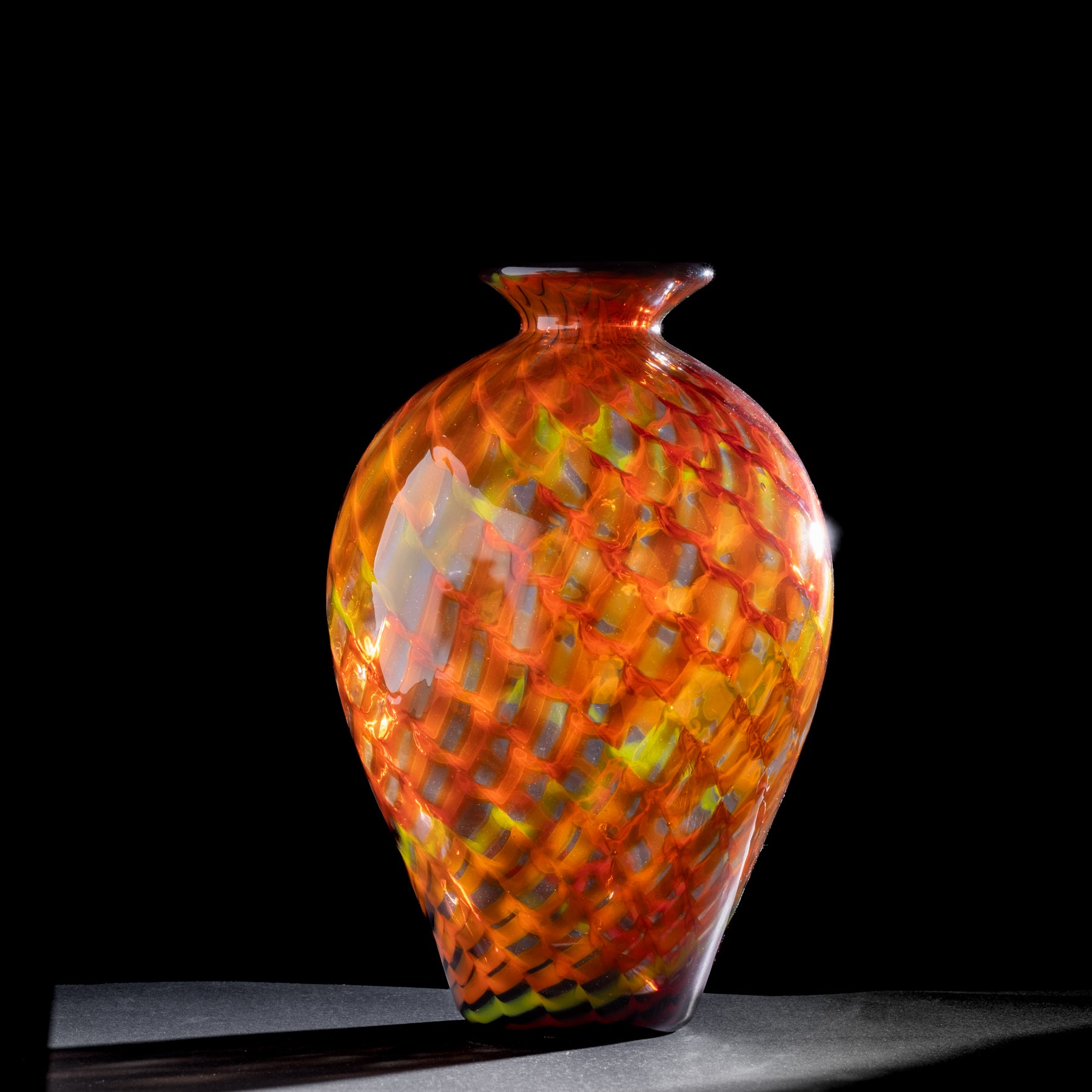 Colorful glass vase on a black background