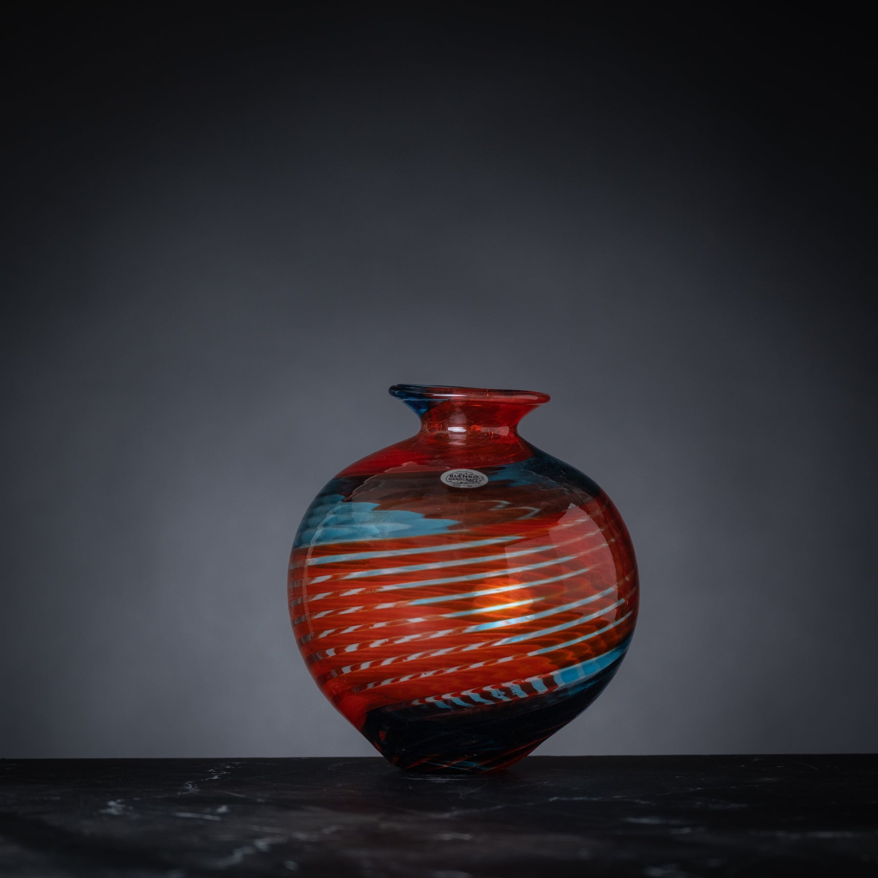 Colorful vase with abstract design on a dark background