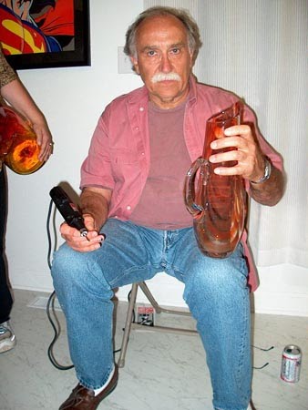 photo of Joh Nickerson holding a large glass pitcher