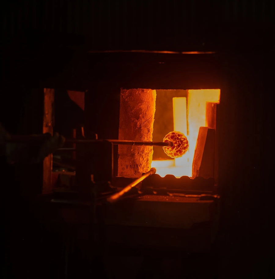 A Blenko team working molten glass