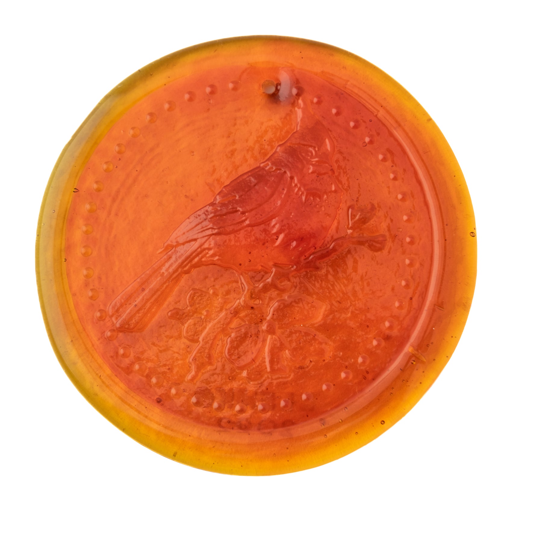 tangerine sun-catcher with a cardinal on it